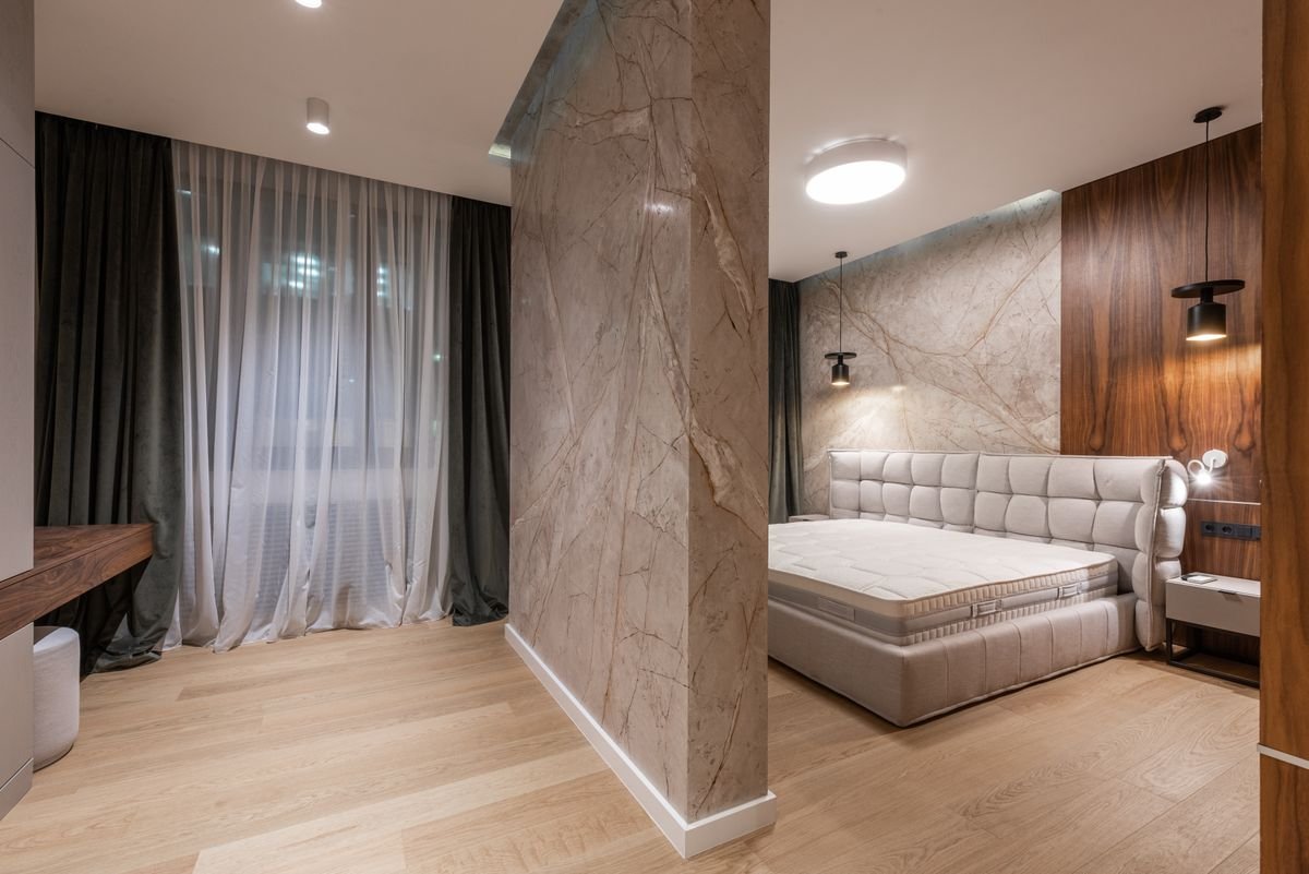 Large-format slab feature walls in a bedroom
